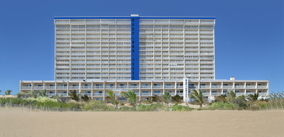 a tall building sitting on top of a sandy beach