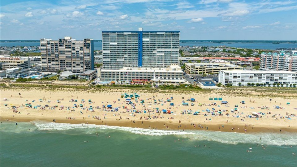 an aerial view of a beach and hotels