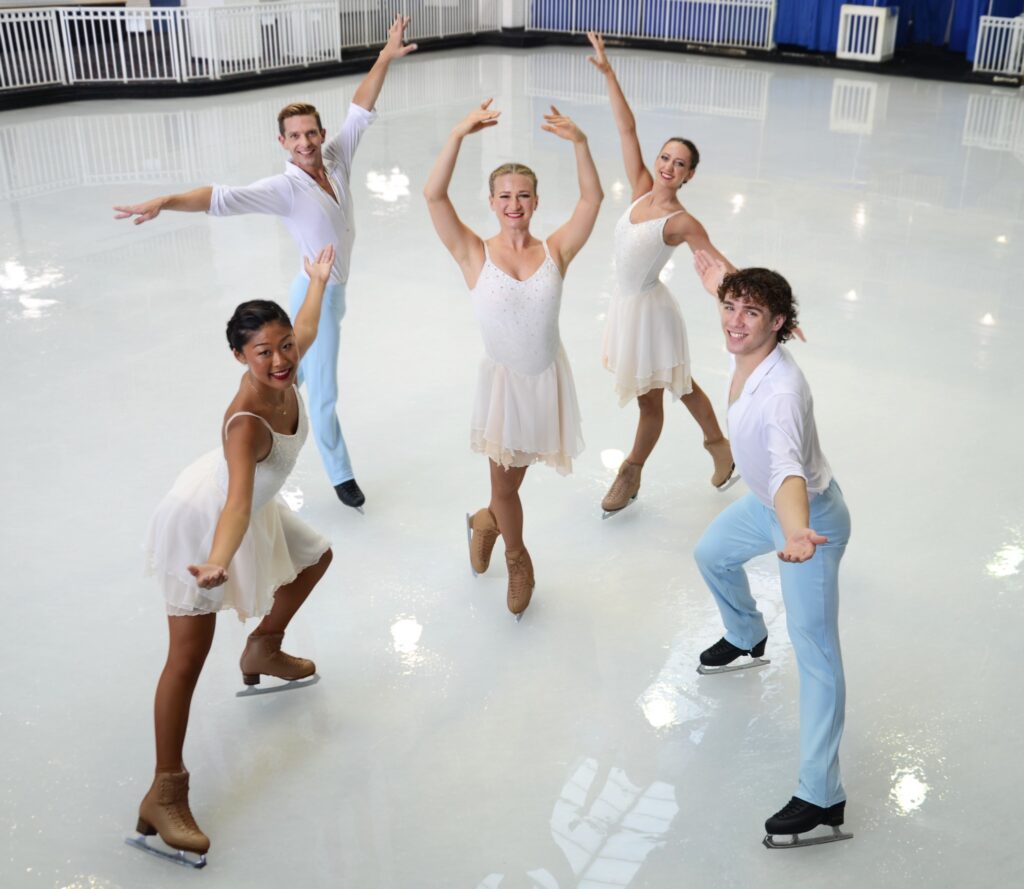 a group of people standing on top of a white floor
