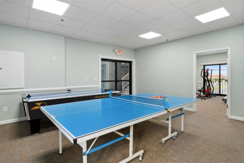 a ping pong table in an empty room